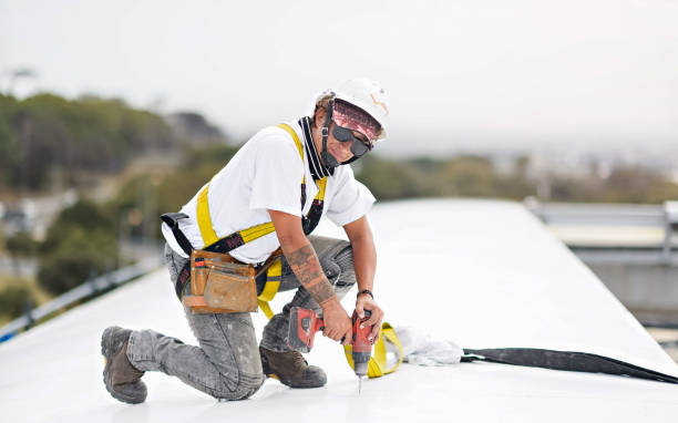 istock Female Construction Worker Full Protective Workwear on site drilling looking at camera 1400552297