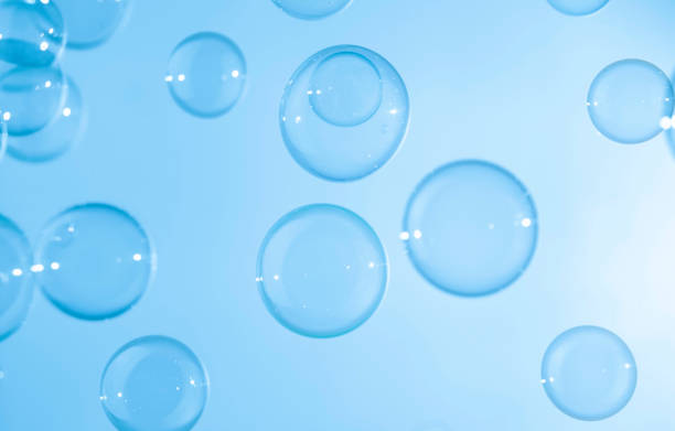 istock Abstract Beautiful Transparent Blue Soap Bubbles Background. Soap Sud Bubbles Water 1400552971