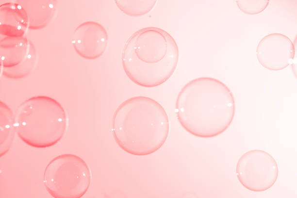 istock Abstract Beautiful Transparent Pink Soap Bubbles Background. Soap Sud Bubbles Water 1400552972