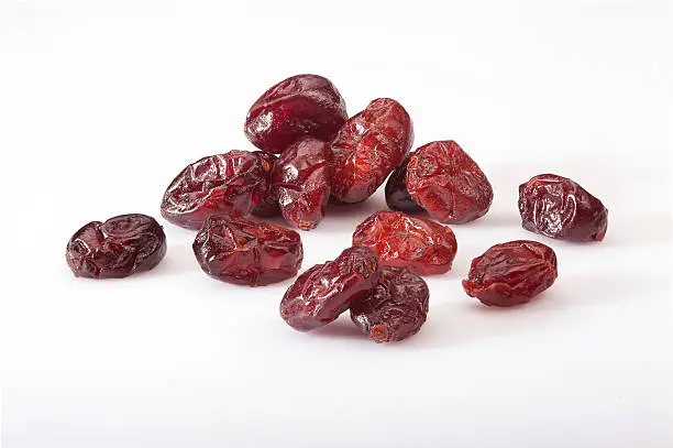 Dry cranberries pile on white background