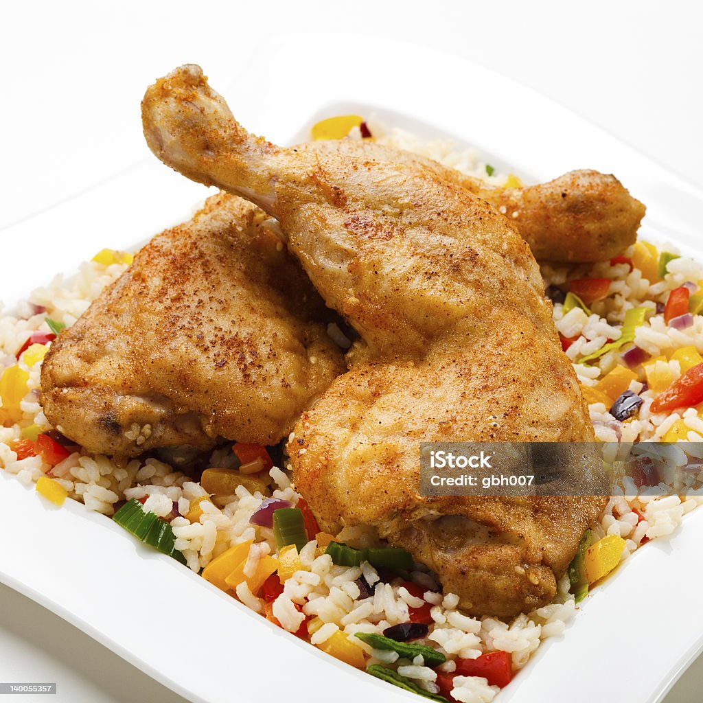 Roasted chicken legs, white rice and vegetables Roasted chicken legs and vegetables  Barbecue - Meal Stock Photo