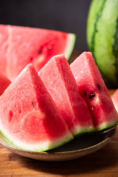 istock fresh sliced watermelon fruit on wooden  background 1400556474