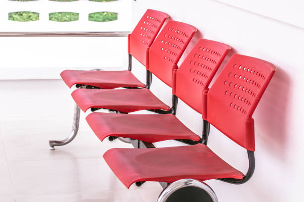istock Red chairs lined up in front of the white room. 1400556711