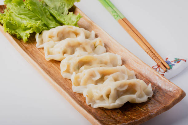 istock Dumplings with meat on a brown plate on the table 1400556905