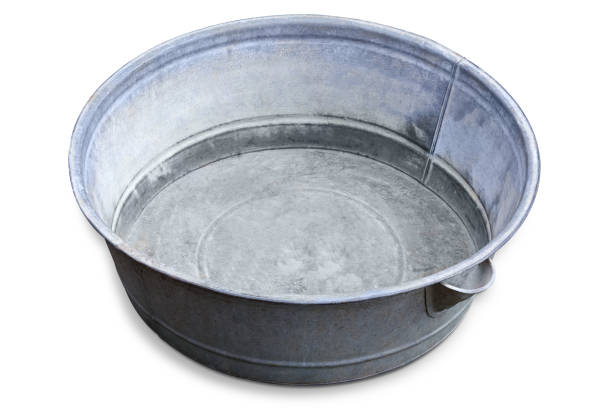 Empty old big round washtub made with galvanized iron on a white background