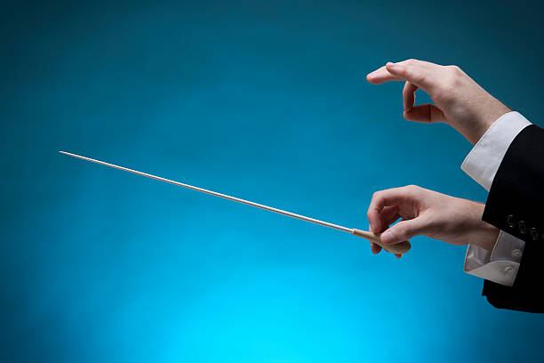 istock A conductor's hands are in position to direct musicians 140056092