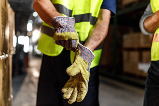 Close up of putting protective gloves in a warehouse!