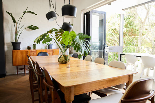 istock Dining room and patio with open doors in a comfortable home 1400562545