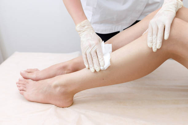 istock The master's hands will rub their feet with a napkin depilation 1400563510