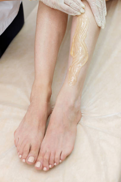 istock feet close-up on shugaring procedure 1400563584