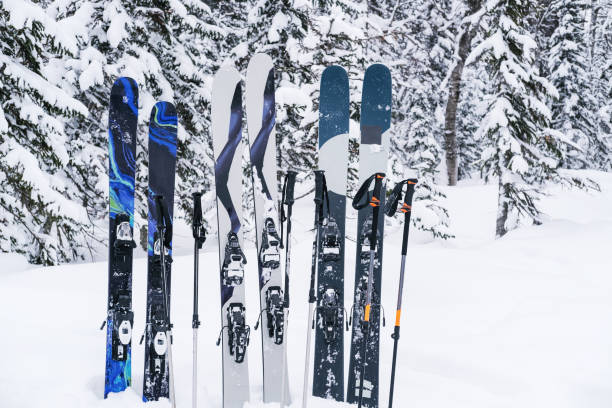istock Skis standing in snowdrifts in spruce forest, trees covered with snow 1400564861