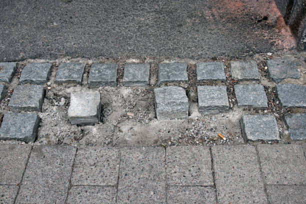 istock loose and missing cobblestones in a walkway 1400565030