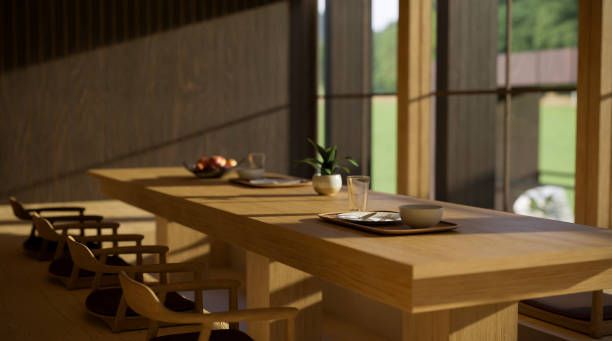 istock Modern contemporary restaurant seating area or dining room interior with long wood table 1400565983