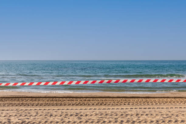 Closed Beach, beach closed caused by pandemic disease situation, shark alarm stock photo