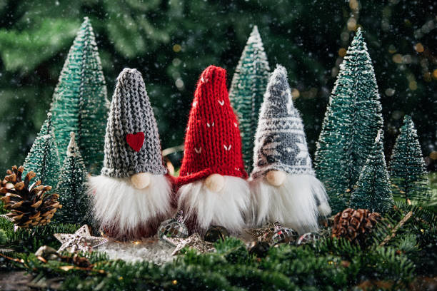 istock Christmas composition with gnome and festive decorations on wooden background. 1400567172