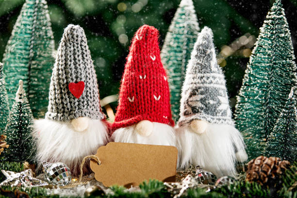 istock Christmas composition with gnome and festive decorations on wooden background. 1400567183