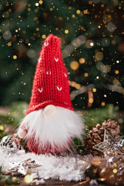 istock Christmas composition with gnome and festive decorations on wooden background. 1400567196