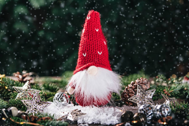 istock Christmas composition with gnome and festive decorations on wooden background. 1400567209