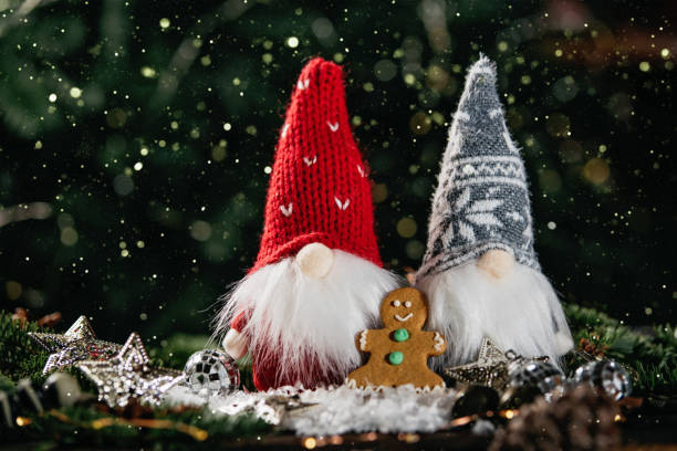 istock Christmas composition with gnome and festive decorations on wooden background. 1400567220