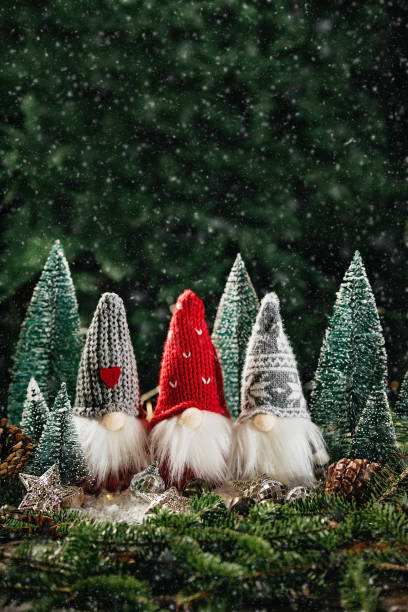 istock Christmas composition with gnome and festive decorations on wooden background. 1400567248