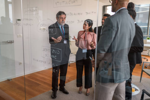 istock Multi-Cultural Group Working On Their Top Ideas To Expand Their Company 1400568007