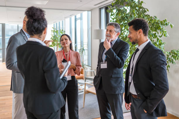 istock Multi-ethnic Informal Meeting in A Modern Office Lobby 1400568022