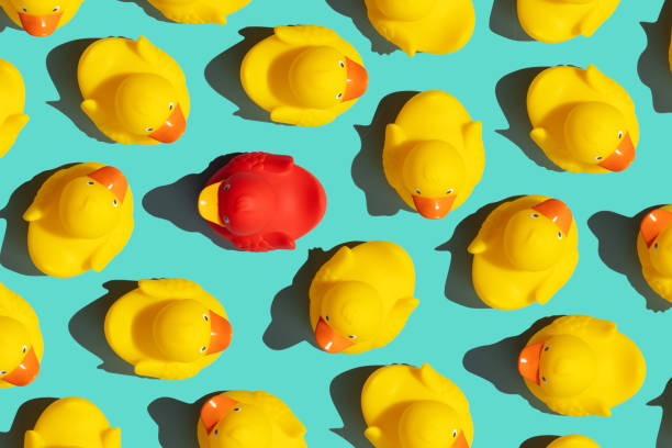 istock One out unique rubber duck concept on a blue background 1400569632