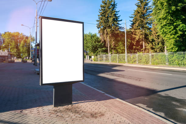 istock Announcement vertical white blank poster stands on urban sidewalk 1400569934