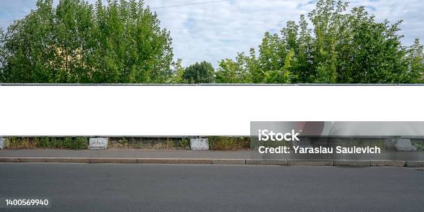 Large Empty White Advert Billboard Fixed On Concrete Fence Stock Photo - Download Image Now