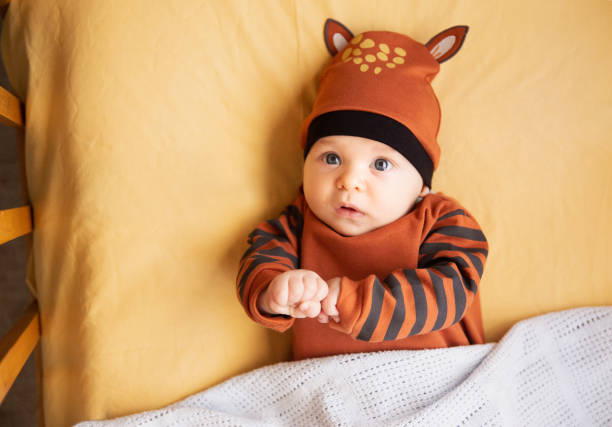 istock Baby boy in a crib 1400571846