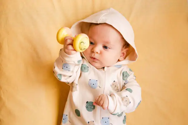 Portrait of a baby on a yellow background