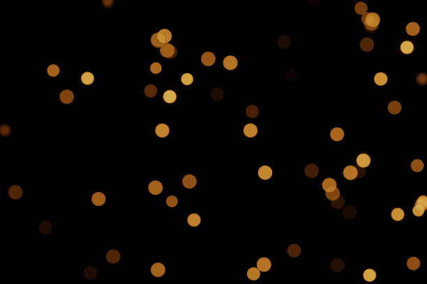 istock Defocused bokeh lights on black background, an abstract naturally blurred backdrop 1400573710