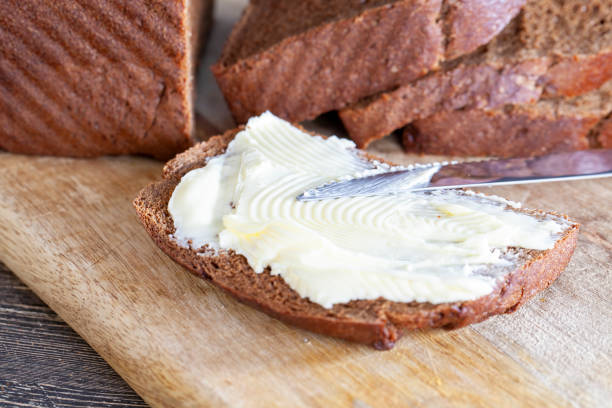 istock slices of black sliced bread with butter spread from milk 1400575701