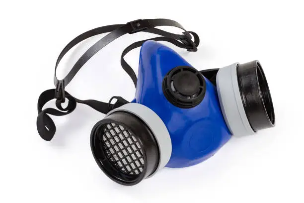 Reusable half-face elastomeric air-purifying respirator with replaceable filters on a white background