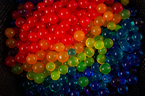 Orbeez. Hydrogel balls or many colorful beads, close-up.