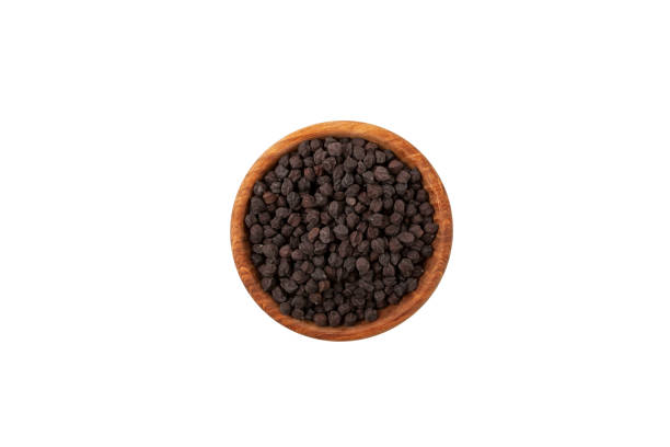 istock Black chickpeas in wooden bowl on white background, top view 1400578687