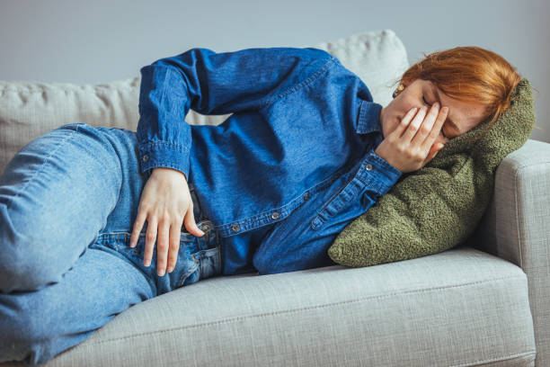 istock Young sick woman with hands holding pressing her crotch lower abdomen 1400580900