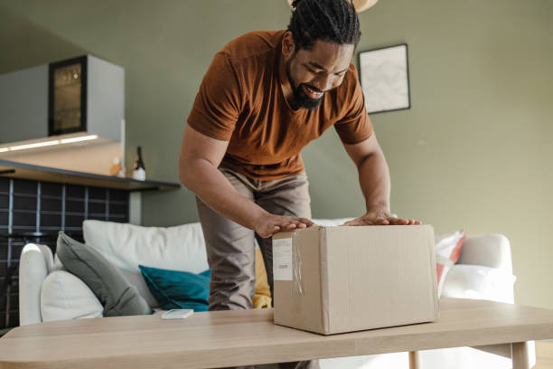 istock Young African American man has just received his online order 1400583615