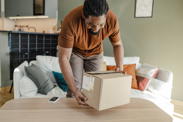 istock Young African American man has just received his online order 1400583617