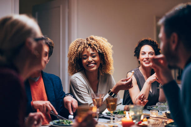 istock Group Of Friends Having Fun During A Dinner Celebration 1400584584