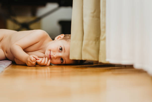 Toddler on the floor smilling