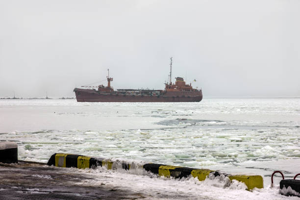 istock Cargo vessel sailing in winter 1400590985