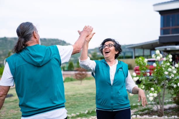 istock Senior couple playing darts together 1400592847
