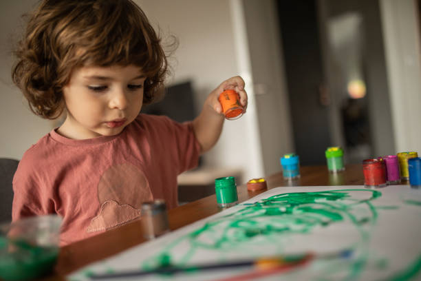 istock Little boy painting at home 1400596793