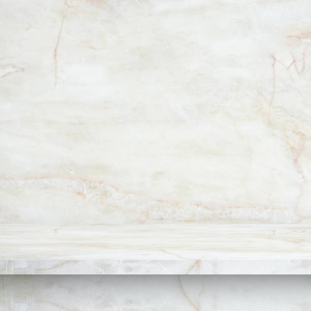 istock perspective of polished light colored marble tabletop and marble wall for interior and display show products. studio room 1400598600