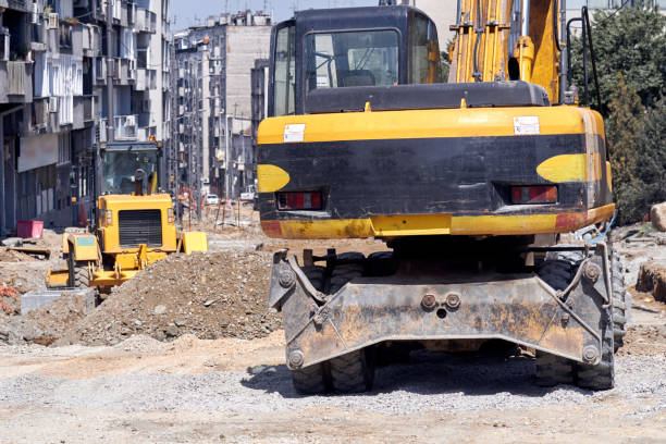 istock Heavy construction machines outdoors for public place reconstruction. 1400599942