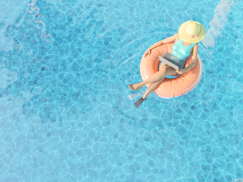 From above of 3D rendering of anonymous female freelancer in swimsuit and straw hat sitting in inflatable swim tube in pool and working remotely on laptop during summer holidays