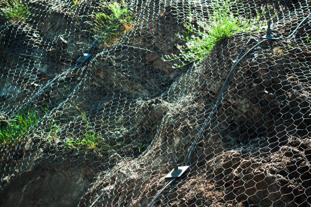 istock Metal protective net on a hill. Rolling stone protection. 1400600824