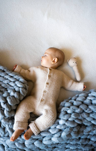 istock Baby sleeping on the blanket at home 1400603887