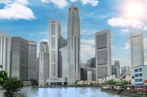 SINGAPORE, SINGAPORE - JAN 2022: Chinatown with its distinct low-rise shophouses against the backdrop of the city's financial district and skyscrapers